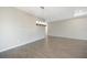 Bright dining room with hardwood floors and a modern chandelier at 2275 Hamburg Ln, Punta Gorda, FL 33983