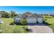 House exterior showcasing a two-car garage and manicured lawn at 2275 Hamburg Ln, Punta Gorda, FL 33983