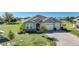 House exterior showcasing a two-car garage and manicured lawn at 2275 Hamburg Ln, Punta Gorda, FL 33983