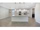 Modern kitchen with white cabinets, granite countertops, and an island at 2275 Hamburg Ln, Punta Gorda, FL 33983