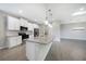 Modern kitchen with white cabinets, granite countertops and stainless steel appliances at 2275 Hamburg Ln, Punta Gorda, FL 33983
