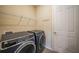 Laundry room with washer, dryer and shelving at 2275 Hamburg Ln, Punta Gorda, FL 33983