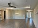 Open living room with tile floors, high ceilings and a ceiling fan at 2275 Hamburg Ln, Punta Gorda, FL 33983