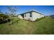 Exterior view of the house showcasing landscaping at 2275 Hamburg Ln, Punta Gorda, FL 33983