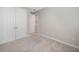 Spacious bedroom with double doors and carpet flooring at 2275 Hamburg Ln, Punta Gorda, FL 33983