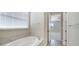 Bathroom features a large soaking tub and neutral color scheme at 2275 Hamburg Ln, Punta Gorda, FL 33983