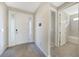 Bright entryway with tile floors and access to a bathroom at 2275 Hamburg Ln, Punta Gorda, FL 33983