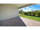 Covered patio overlooking a beautifully landscaped backyard at 2275 Hamburg Ln, Punta Gorda, FL 33983