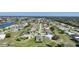 Aerial view of a residential community with numerous houses and lush landscaping at 2275 Hamburg Ln, Punta Gorda, FL 33983