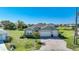 House exterior with a paved driveway and landscaping at 2275 Hamburg Ln, Punta Gorda, FL 33983