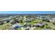 Aerial view of community, showcasing homes and lake at 2275 Hamburg Ln, Punta Gorda, FL 33983
