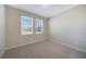 Bright bedroom with two windows and carpet flooring at 2275 Hamburg Ln, Punta Gorda, FL 33983