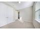 Well-lit bedroom with double doors and carpet flooring at 2275 Hamburg Ln, Punta Gorda, FL 33983