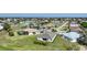 An aerial view of a house and neighborhood, showing surrounding homes and landscape at 2275 Hamburg Ln, Punta Gorda, FL 33983
