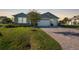 Single-story home with a two-car garage and landscaped front yard at 2275 Hamburg Ln, Punta Gorda, FL 33983