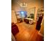Stylish home office with hardwood floors, modern shelving, and plenty of natural light at 7612 Lake Vista Ct # 305, Lakewood Ranch, FL 34202