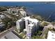 Condo building featuring private balconies with beautiful bay views, palm trees, and modern design at 1400 Barcarrota Blvd W # 201, Bradenton, FL 34205