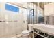 Modern bathroom features a walk-in shower, white subway tile, and stylish vanity at 20910 Parkstone Ter, Bradenton, FL 34202