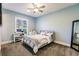 Light blue bedroom with a comfy bed and plenty of natural light at 20910 Parkstone Ter, Bradenton, FL 34202