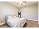 Bedroom with light blue walls, a cozy bed, and a full-length mirror at 20910 Parkstone Ter, Bradenton, FL 34202