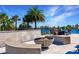 Modern fire pit with built-in seating at 20910 Parkstone Ter, Bradenton, FL 34202