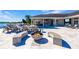 Large fire pit with seating and pool view at 20910 Parkstone Ter, Bradenton, FL 34202