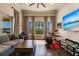 Gathering room includes a drum set, comfortable seating, and large windows with water views at 20910 Parkstone Ter, Bradenton, FL 34202