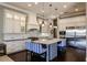 Gourmet kitchen with stainless steel appliances and large island at 20910 Parkstone Ter, Bradenton, FL 34202