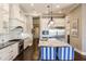 Modern kitchen with white cabinetry and granite countertops at 20910 Parkstone Ter, Bradenton, FL 34202