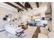 Open living area with kitchen views, hardwood floors, and comfortable seating at 20910 Parkstone Ter, Bradenton, FL 34202