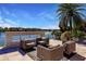 Relaxing patio furniture with fire pit and lake view at 20910 Parkstone Ter, Bradenton, FL 34202