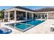 Resort-style pool and spa with outdoor kitchen at 20910 Parkstone Ter, Bradenton, FL 34202