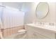 Clean bathroom with white vanity, a shower/tub combo, and pink accents at 20910 Parkstone Ter, Bradenton, FL 34202