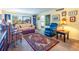 Cozy living room with a comfortable sofa, arm chair, and decorative rug at 1400 Barcarrota Blvd W # 201, Bradenton, FL 34205
