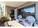 Private balcony with patio furniture and lush greenery at 1400 Barcarrota Blvd W # 201, Bradenton, FL 34205
