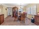 Bright dining room featuring a wood table and chairs, and a built-in hutch at 1400 Barcarrota Blvd W # 201, Bradenton, FL 34205