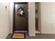 Welcoming entryway with a decorative wreath and welcome mat at 1400 Barcarrota Blvd W # 201, Bradenton, FL 34205