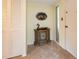 Condo entryway featuring a decorative cabinet and wall art at 1400 Barcarrota Blvd W # 201, Bradenton, FL 34205