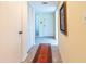 Bright condo entryway with tile floor, coat closet, and artwork at 1400 Barcarrota Blvd W # 201, Bradenton, FL 34205