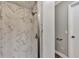 Modern bathroom highlighting an all-tile shower, sleek fixtures, and a bright, clean aesthetic at 4512 Ulster Ave, North Port, FL 34287
