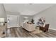 Inviting living room featuring a modern aesthetic, wood floors, and plenty of natural light at 4512 Ulster Ave, North Port, FL 34287