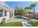 Inviting pool area with brick pavers, lounge chairs, and lush landscaping at 1964 Datura St, Sarasota, FL 34239