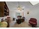 Home office with built-in shelving, desk, and comfortable chair at 4674 Hidden River Rd, Sarasota, FL 34240