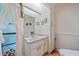 Small half bathroom with sink and toilet at 4674 Hidden River Rd, Sarasota, FL 34240