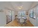 Cozy dining area with wood floors and view of the pool at 4674 Hidden River Rd, Sarasota, FL 34240