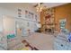 Living room showcasing a stone fireplace, large TV, and comfy seating at 4674 Hidden River Rd, Sarasota, FL 34240