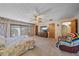 Bright Primary bedroom with patio access and ceiling fan at 4674 Hidden River Rd, Sarasota, FL 34240