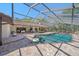 Inviting kidney-shaped pool with screened enclosure, perfect for relaxation at 4674 Hidden River Rd, Sarasota, FL 34240