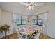 Bright dining area with wood floors and pool view at 4674 Hidden River Rd, Sarasota, FL 34240