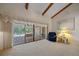Living area with sliding doors opening to a relaxing pool view at 4674 Hidden River Rd, Sarasota, FL 34240